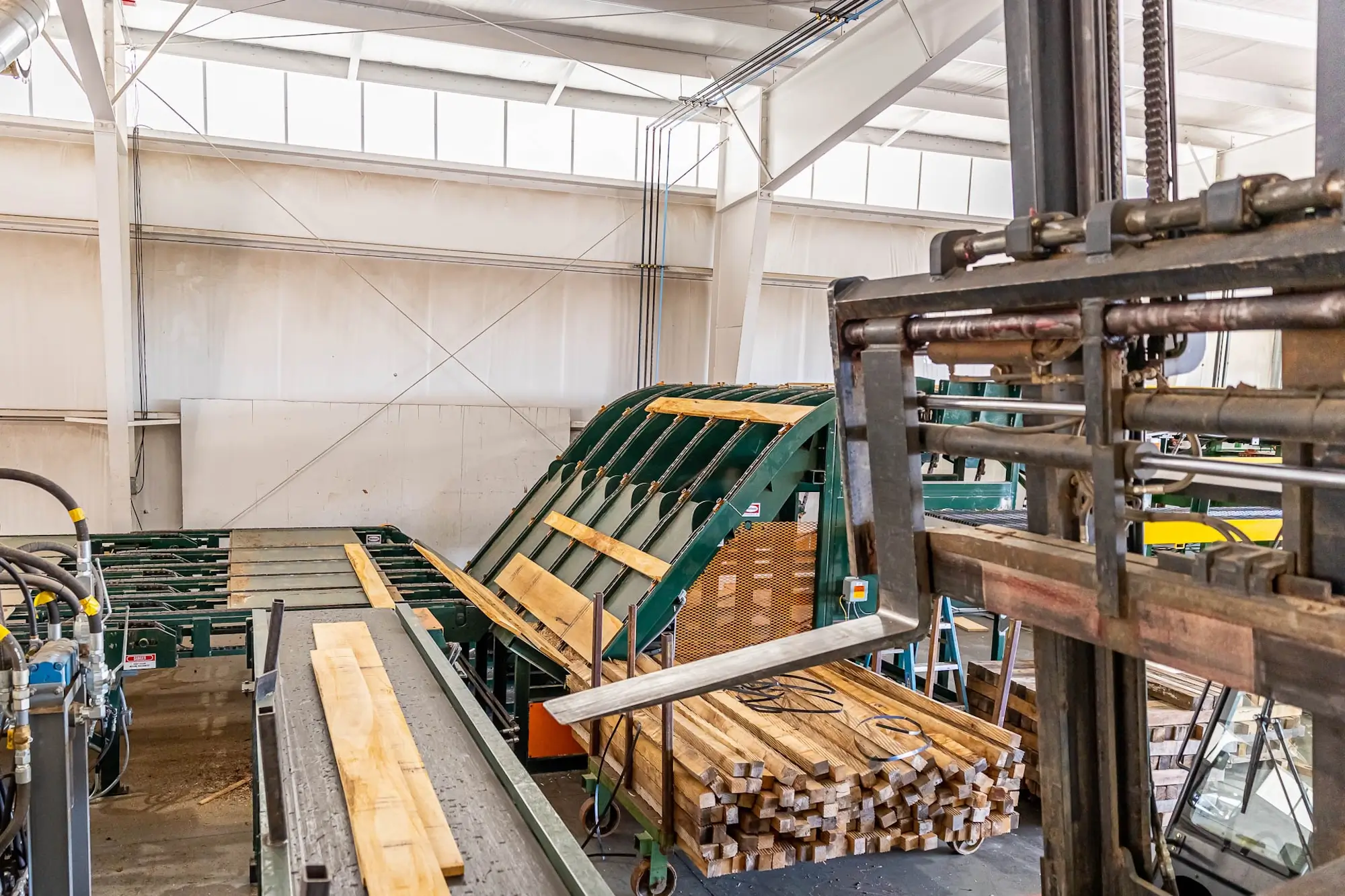 Hardwood being processed by machines at Stoltzfus Hardwoods.