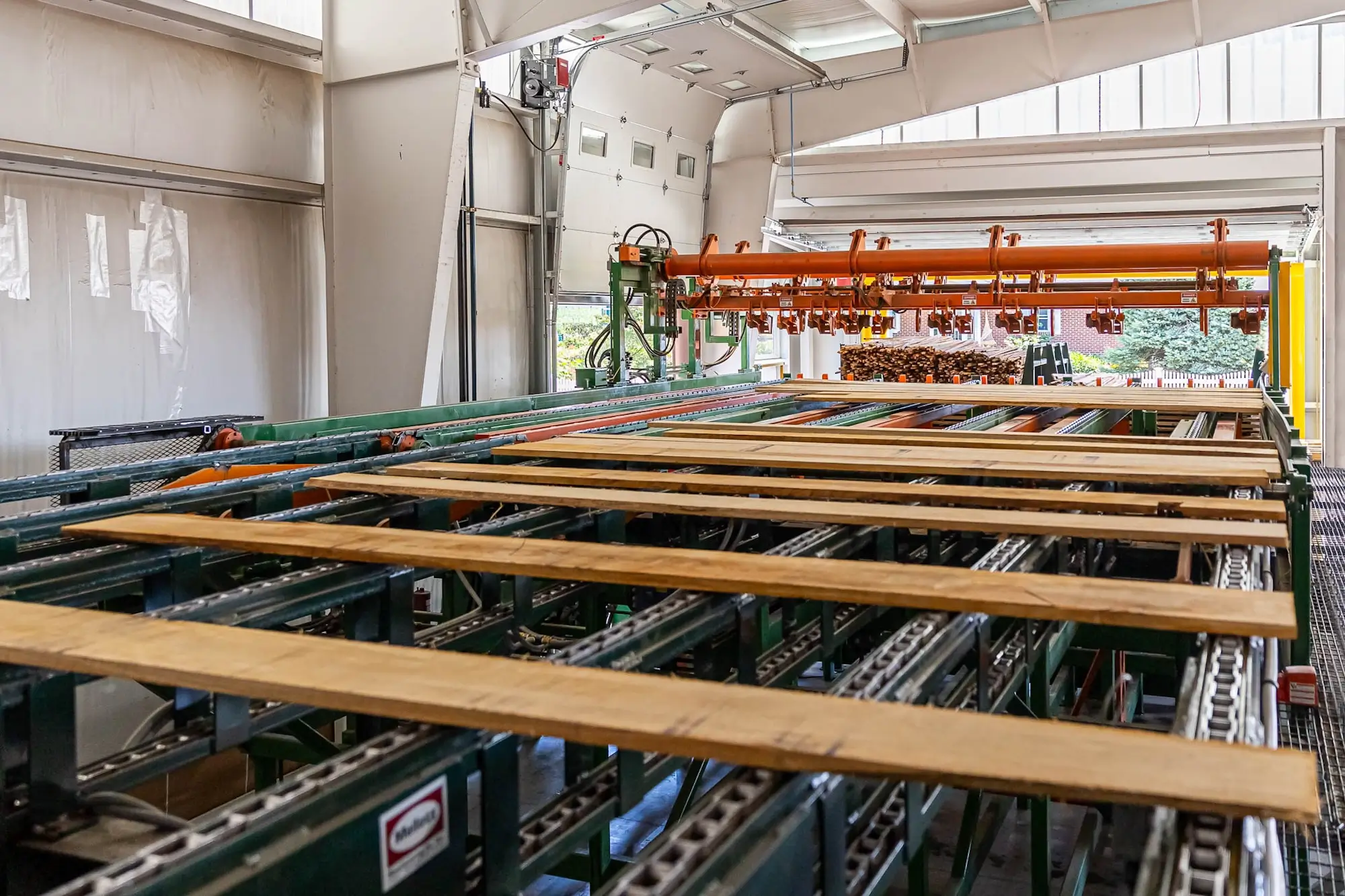 Hardwood being processed by machines at Stoltzfus Hardwoods.