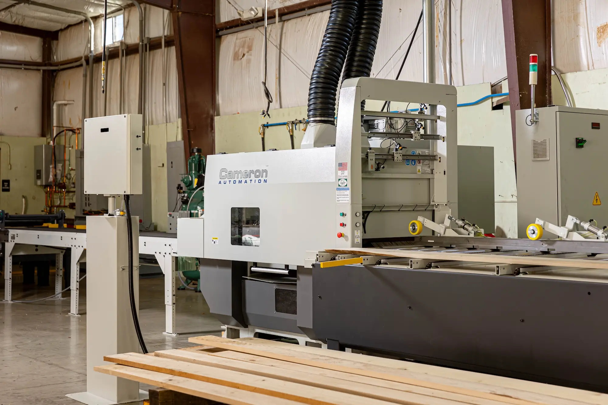 Hardwood being processed by machines at Stoltzfus Hardwoods.